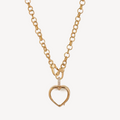 Gold necklace with a heart-shaped pendant on a white background