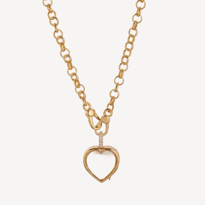 Gold necklace with a heart-shaped pendant on a white background