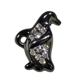 Black animal-shaped charm with embedded crystals on a white background