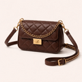Brown quilted handbag with gold chain strap on a white background