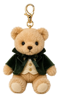A plush teddy bear keychain wearing a dark green velvet jacket, cream vest, and bow tie, attached to a gold metal clasp, on a white background.