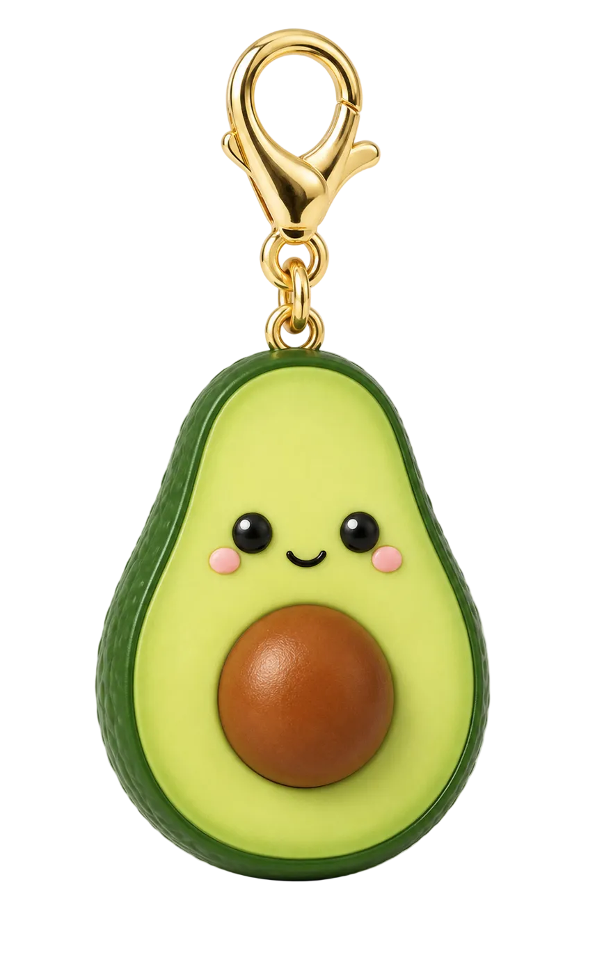 A cute avocado-shaped keychain or bag charm with a smiling face, pink cheeks, and a brown pit, attached to a gold lobster clasp on a white background.