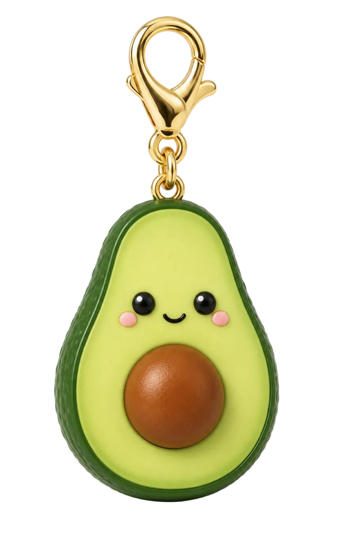 A cute avocado-shaped keychain or bag charm with a smiling face, pink cheeks, and a brown pit, attached to a gold lobster clasp on a white background.