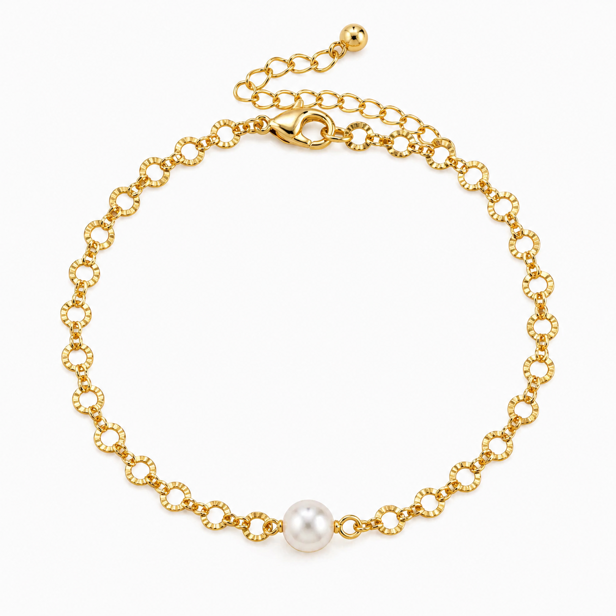 Gold bracelet with a single pearl on a white background