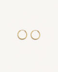 Gold hoop earrings on a white background