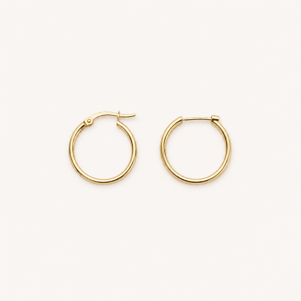 Gold hoop earrings on a white background