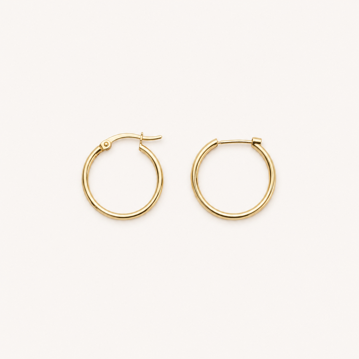 Gold hoop earrings on a white background