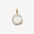 Gold pendant with a clear stone on a white background