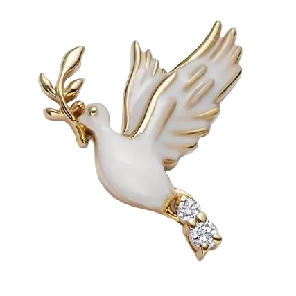 Gold and white dove-shaped brooch with a diamond on a light beige background