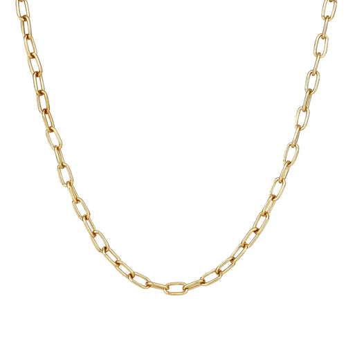 Gold chain necklace on a light beige background