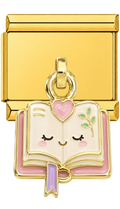 Gold charm with a cartoon-style book and heart design on a white background