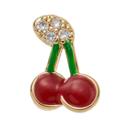 Jewelry pendant shaped like cherries with a gold and diamond top on a white background