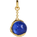 Gold pendant with a blue gemstone on a light gray background