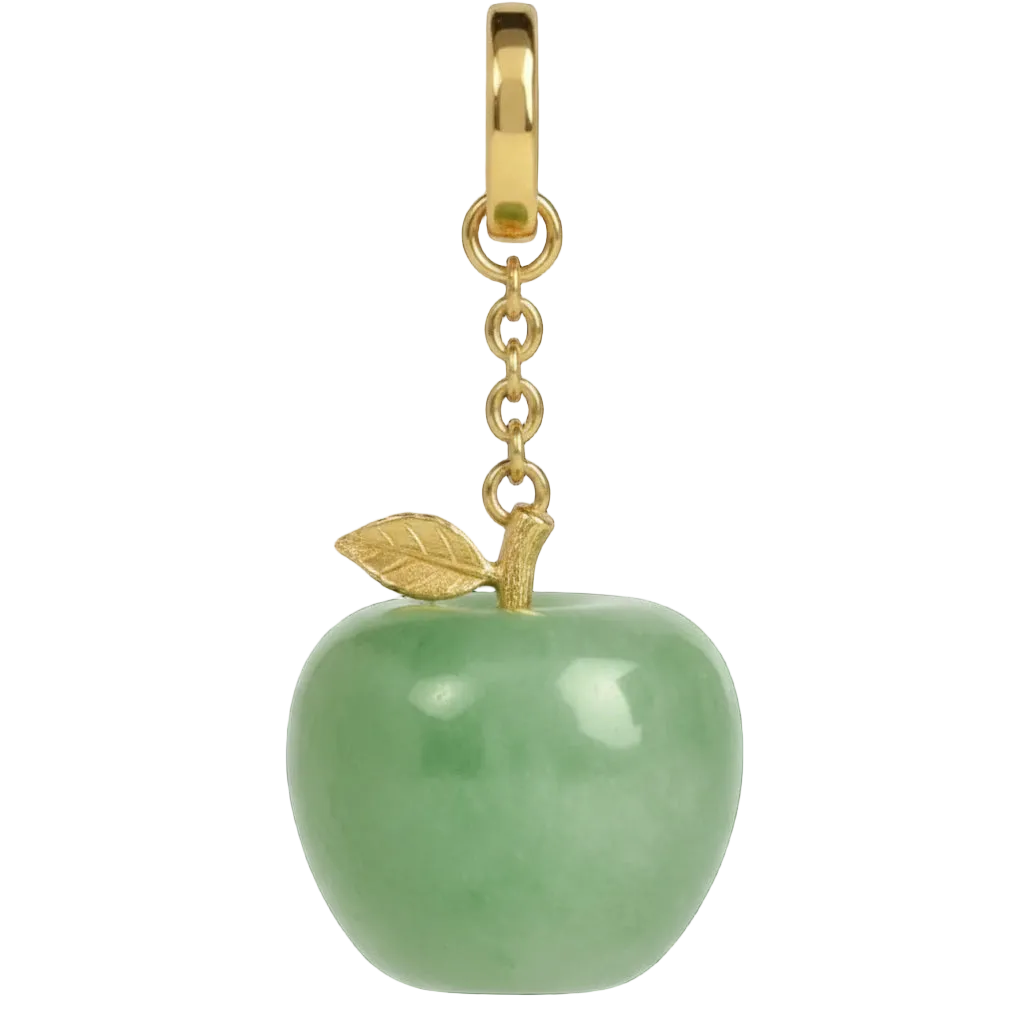 Green apple-shaped pendant with gold chain and leaf on a black background