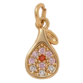 Gold teardrop-shaped pendant with colorful gemstones on a beige background